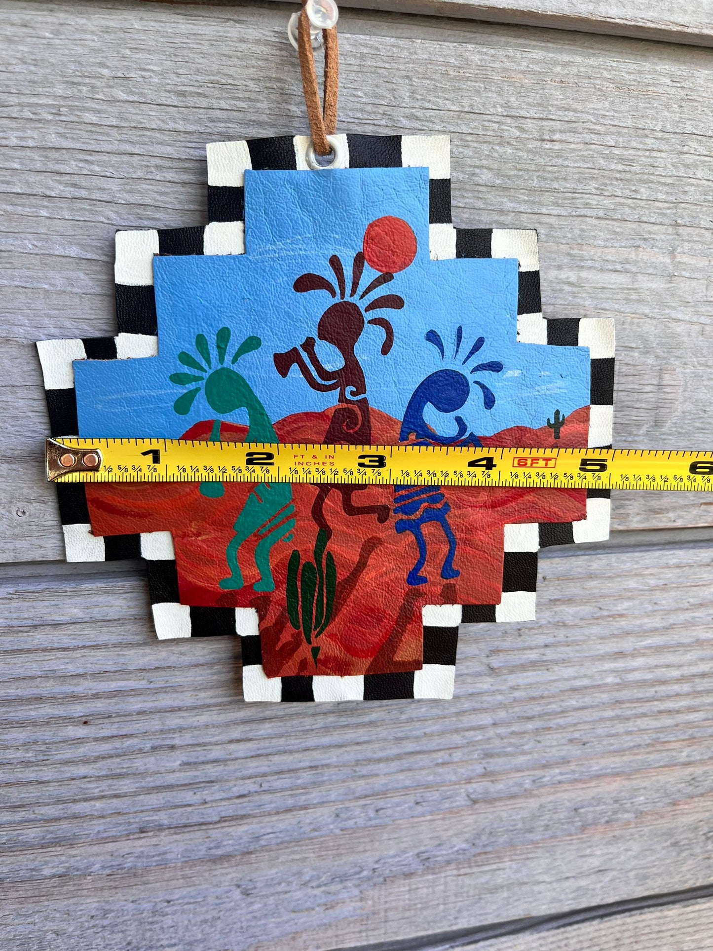 Painted leather ornament kokopelli