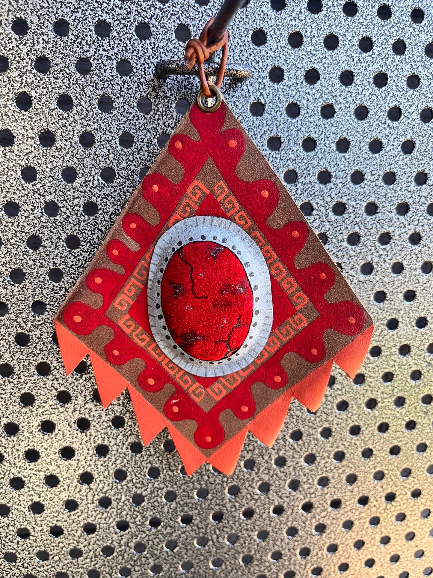 Bright red western leather ornament